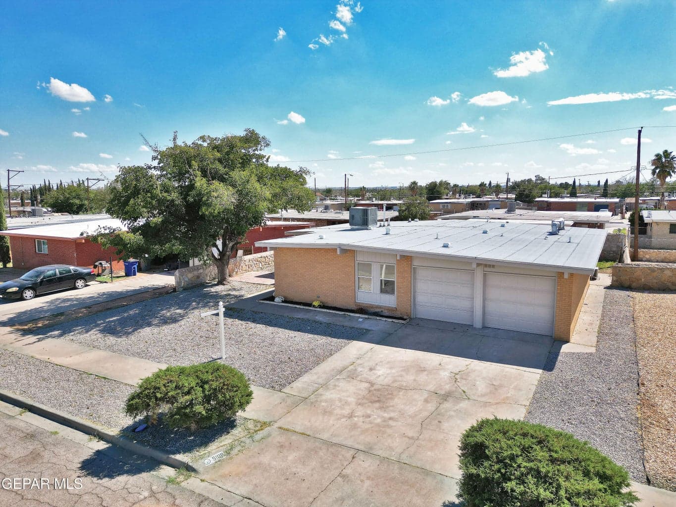 Wide aerial view of the front elevation and nearby Milagro Hills homes