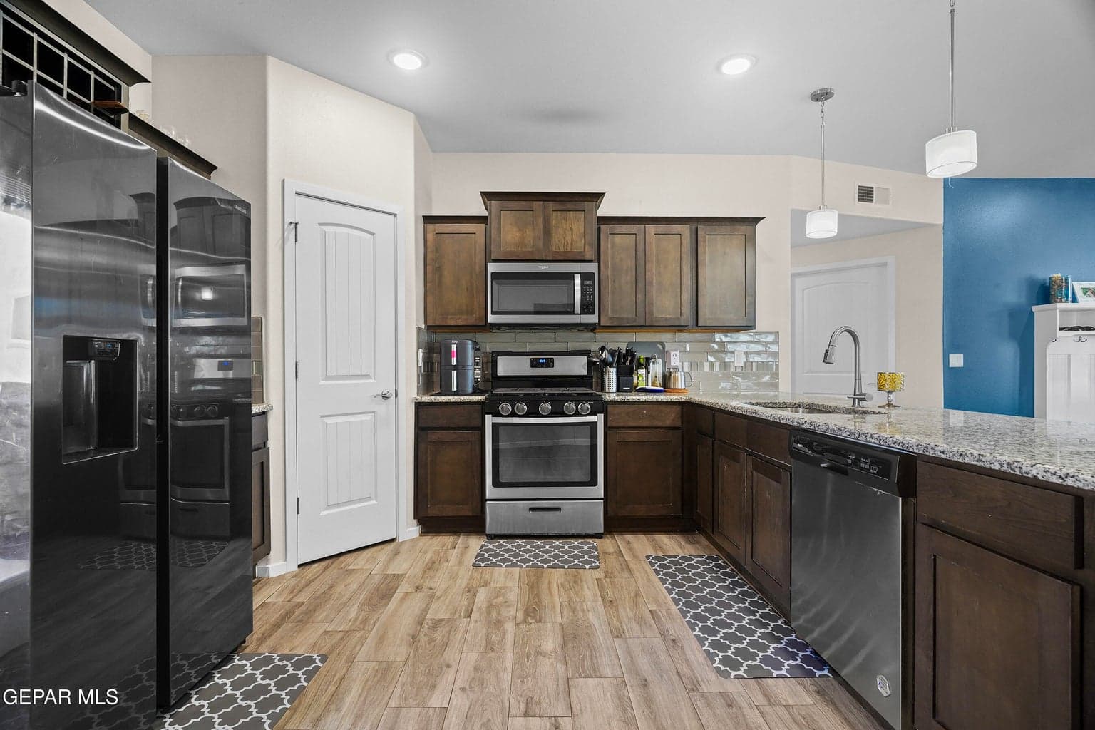 Enjoy abundant granite countertop space, stainless steel appliances, and ample cabinetry