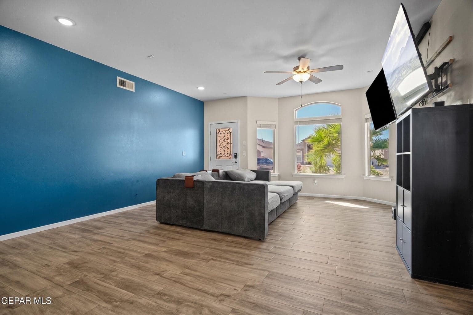 Enjoy a spacious gathering area with tile flooring and large windows