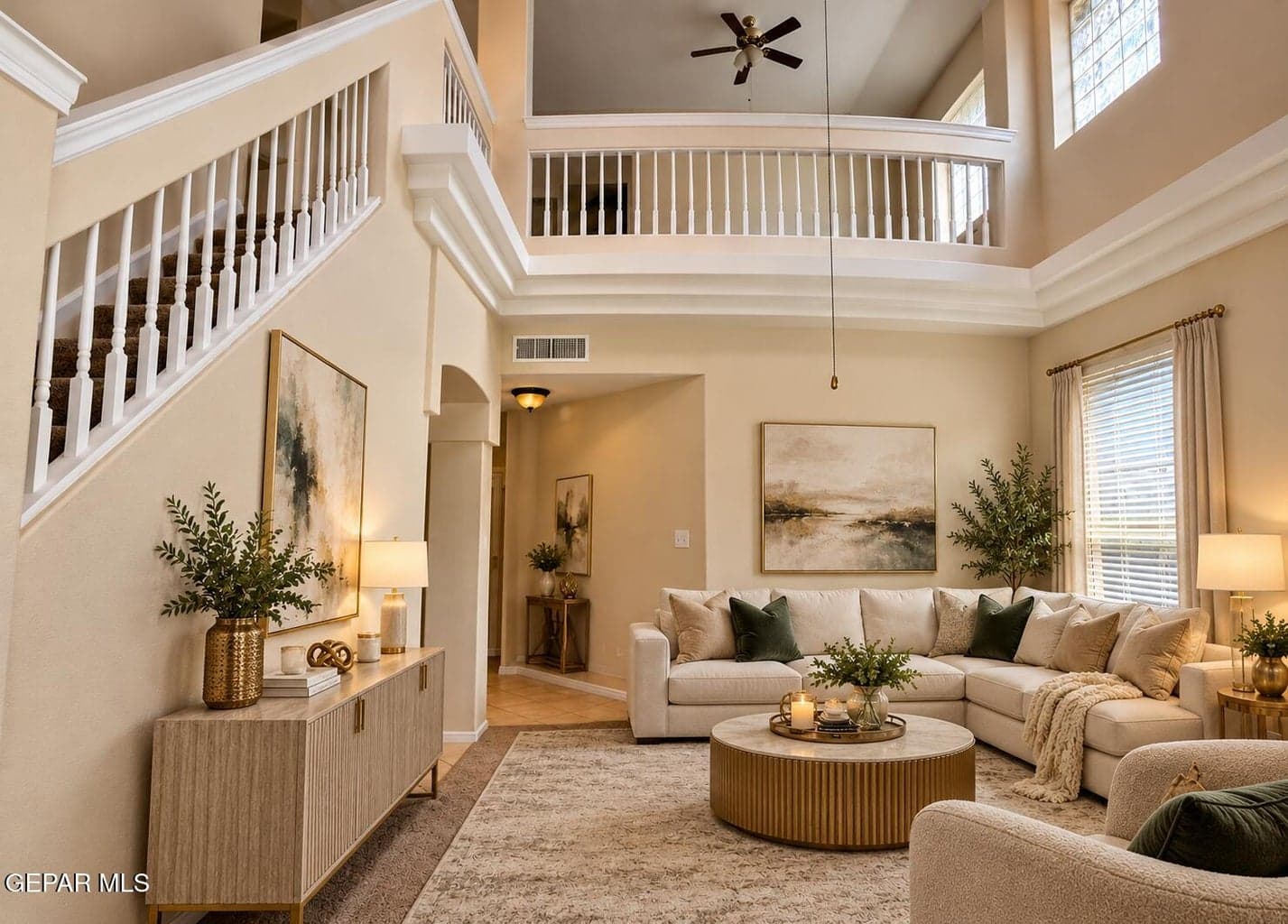 Two-story entry with soaring ceilings. Virtually staged; furnishings not included.