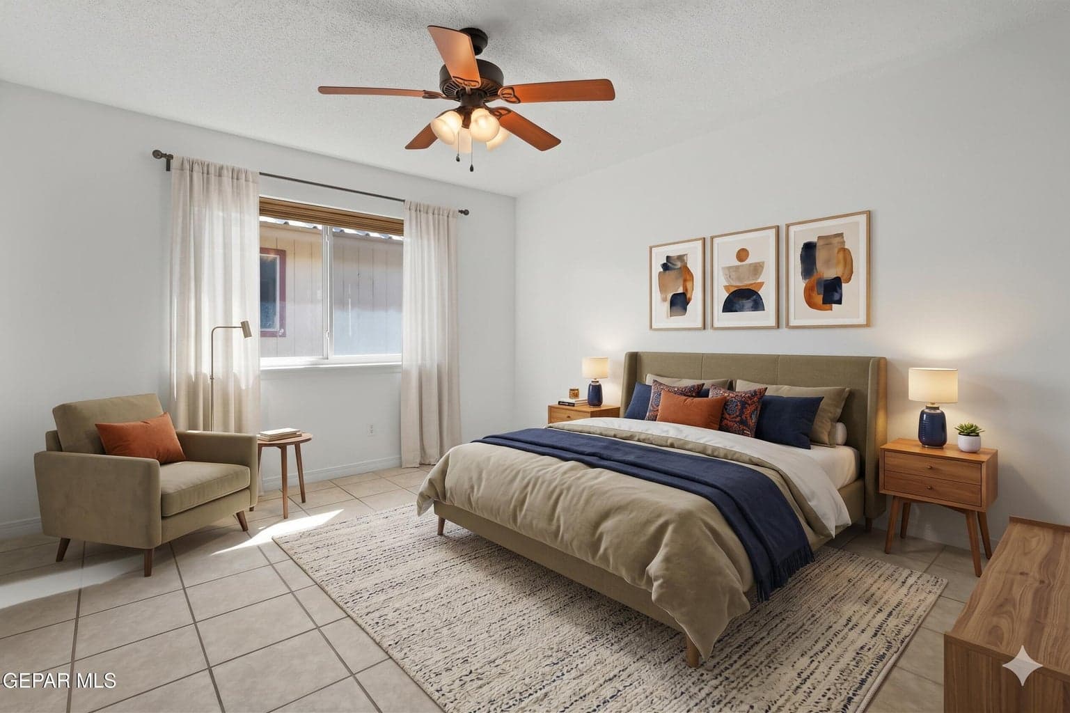 Features tile flooring, a ceiling fan, and a closet for everyday comfort and storage.