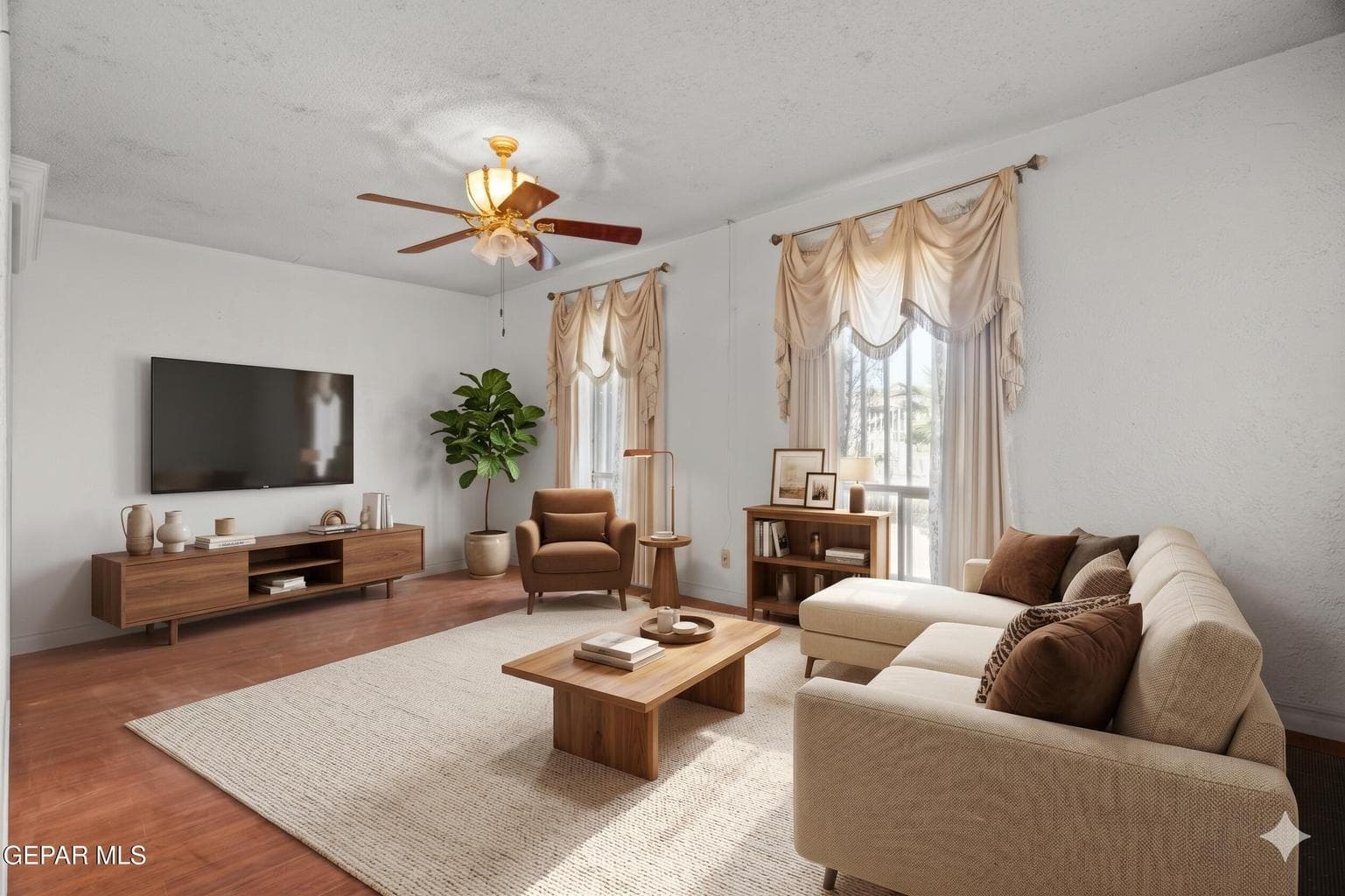 Features wood flooring, a ceiling fan, and large windows
