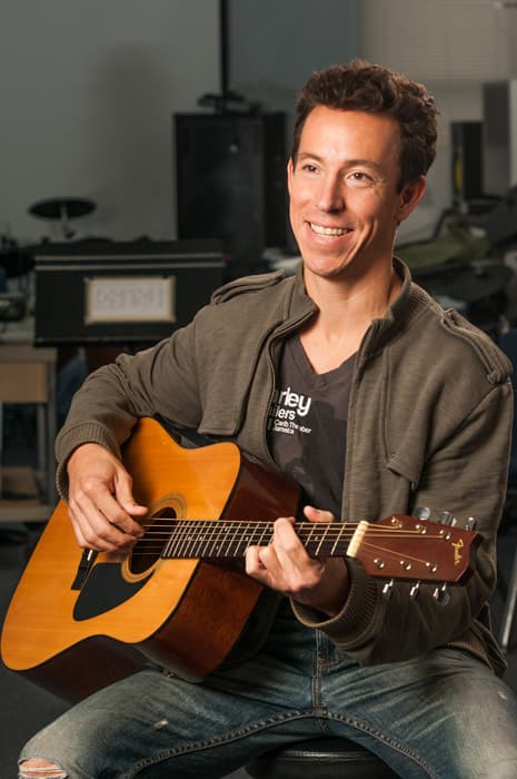 John Peña playing guitar