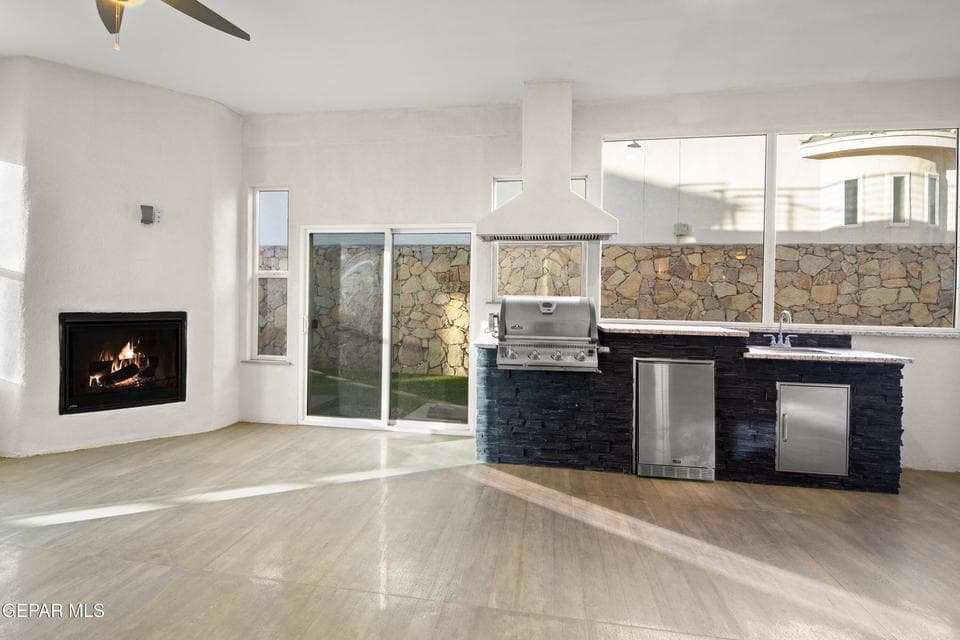 Enclosed patio with full kitchen and fireplace